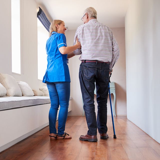 /contrib/content/uploads/sites/415/2022/07/2022-7-12-nurse-helping-man-walk-in-a-care-facility_Shutterstock_640x640_Monkey-Business-Images.jpg